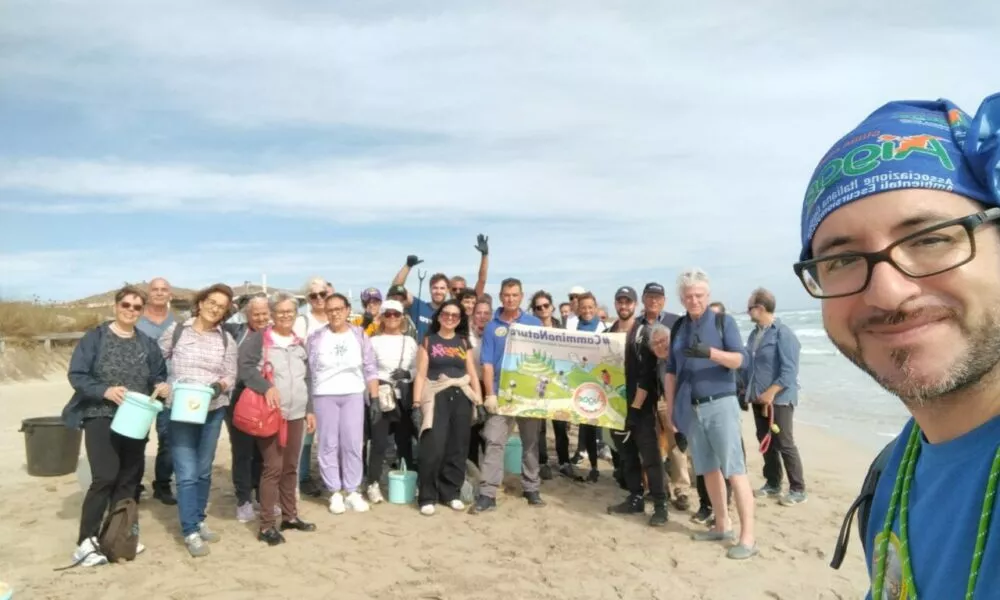 Eco-walk at Ugento's Coastal Park. Group of volunteers cleaning the beach. Environmental awareness and community involvement.